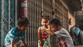 Thai kids playing on the quiet street, Thailand